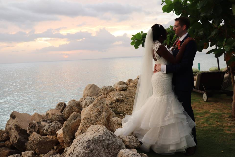 Bride and groom overlooking the sea
