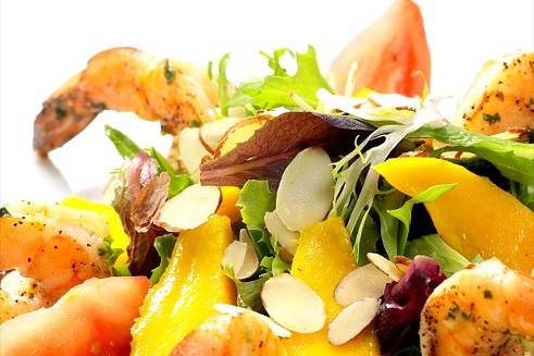 Exquisite Shrimp Salad with fresh mangos in a homemade lime and herbs dressing.