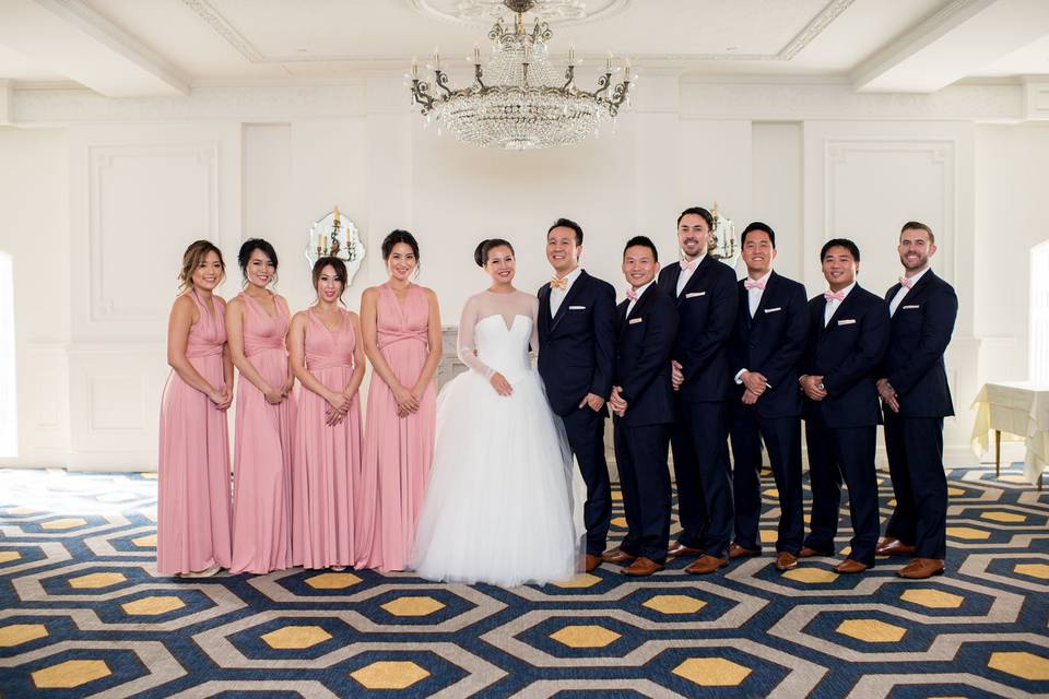 The couple with the bridesmaids and groomsmen