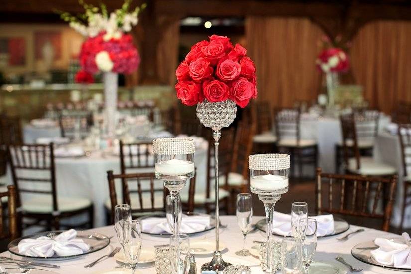 Table setup with floral and candle centerpiece