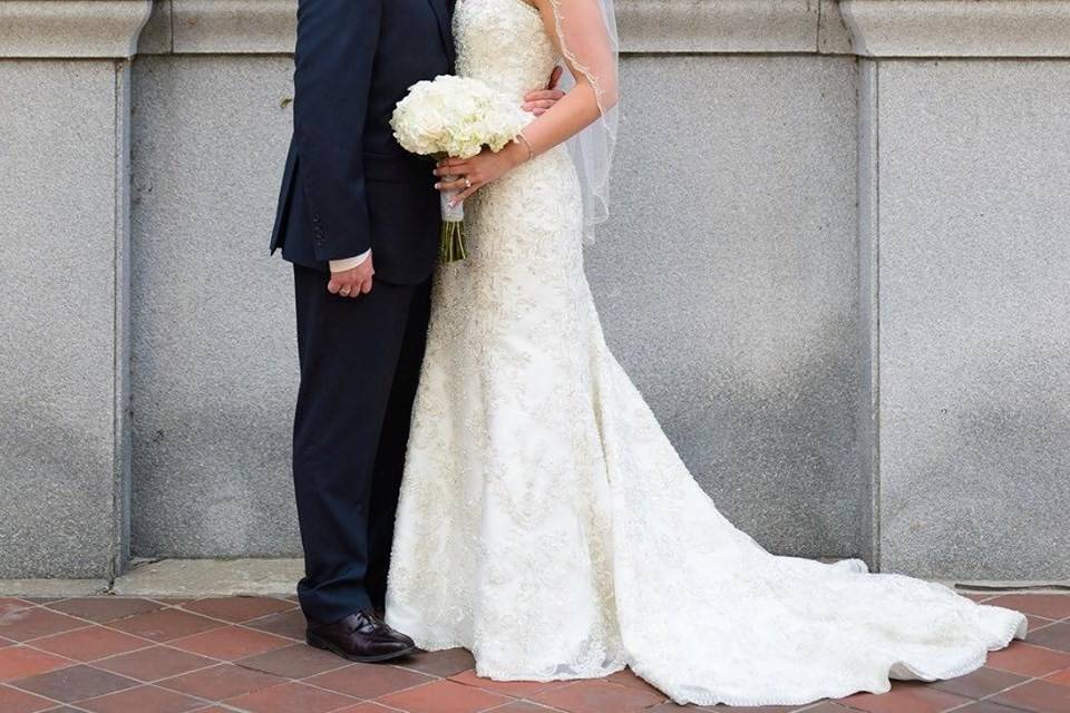 Groom kisses his bride's cheek