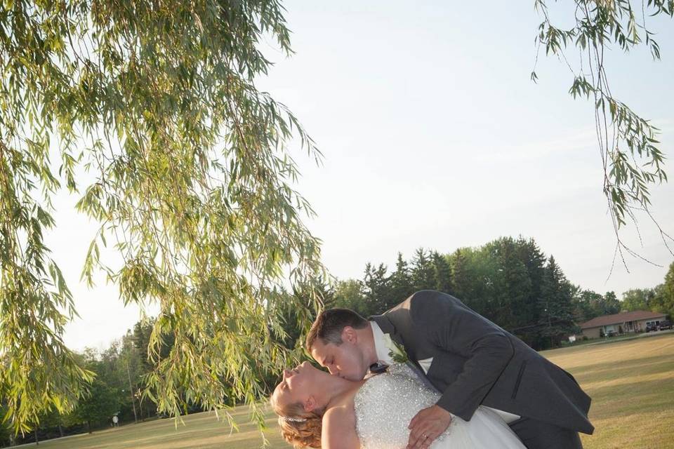 Groom kissing his bride