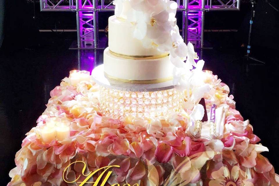 White wedding cake with flowers at the bottom