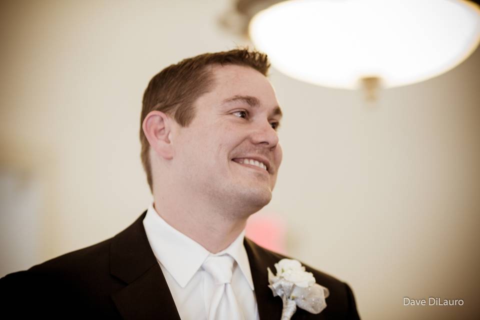 Groom watching his bride