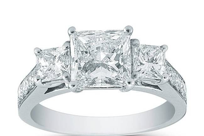 <b>Platinum Three Stone Princess Cut & Pave Setting</b><br>The dazzling 1.59ct Princess cut center stone is GIA certified and is H in color and V in clarity. This setting is adorned with two princess cut side diamonds as well as smaller round brilliant pave-set diamonds on the band.