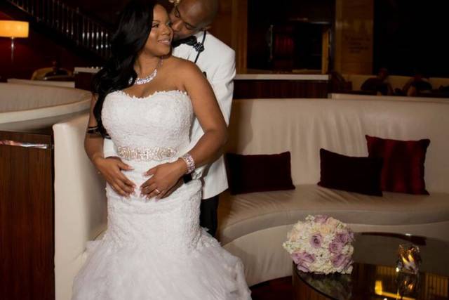 Groom embraces his bride