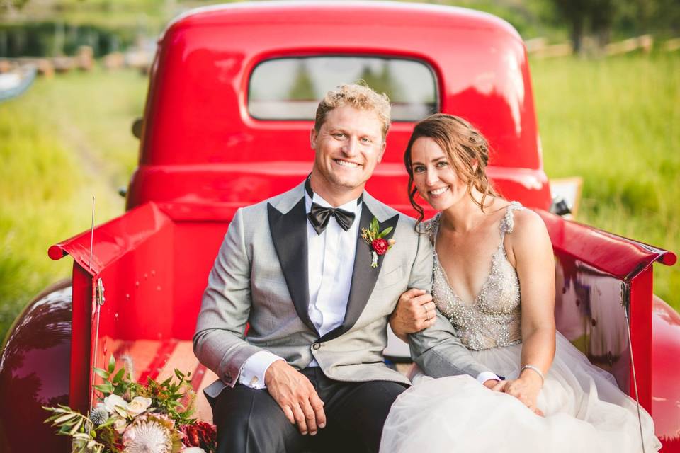 Couple on a shiny red truck