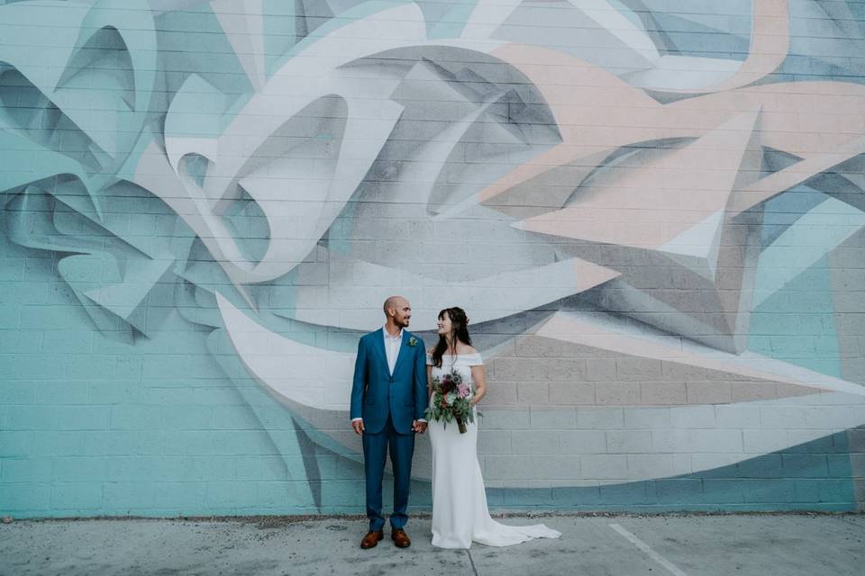 Couple hold hands downtown