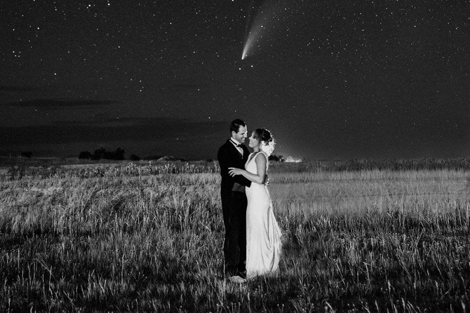 Couple underneath a comet