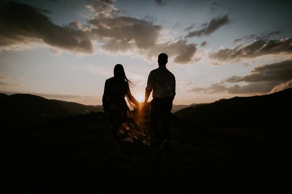 Couple walk into sunset