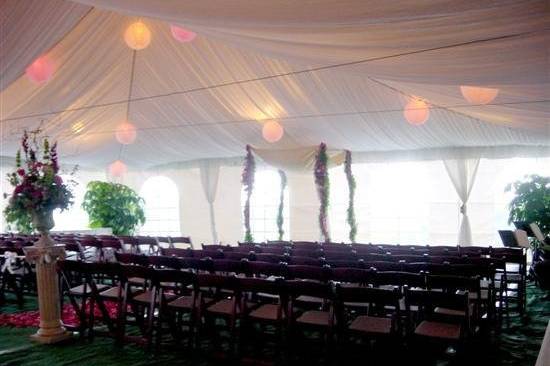 Tent with ceiling liner and lighting, and ceremony chairs