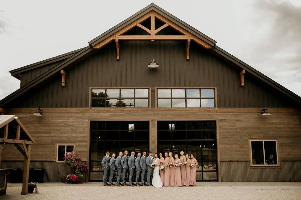 Bridal party in front of doors