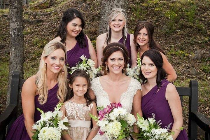 The bride with her bridesmaids and flower girl