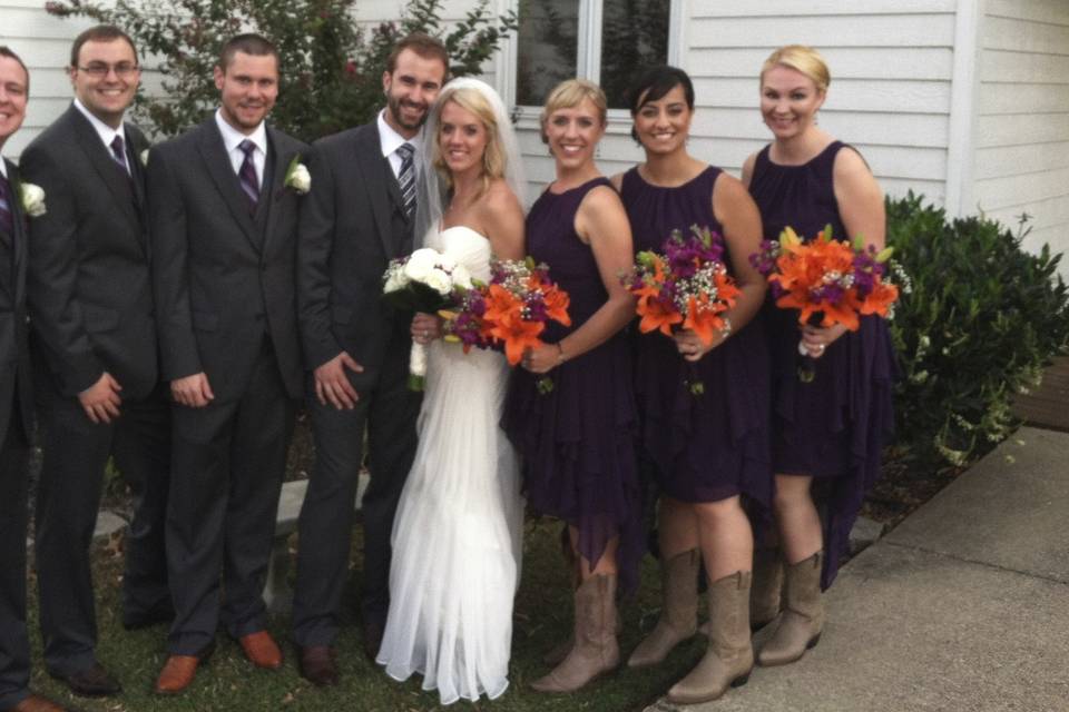 The couple with the bridesmaids and groomsmen