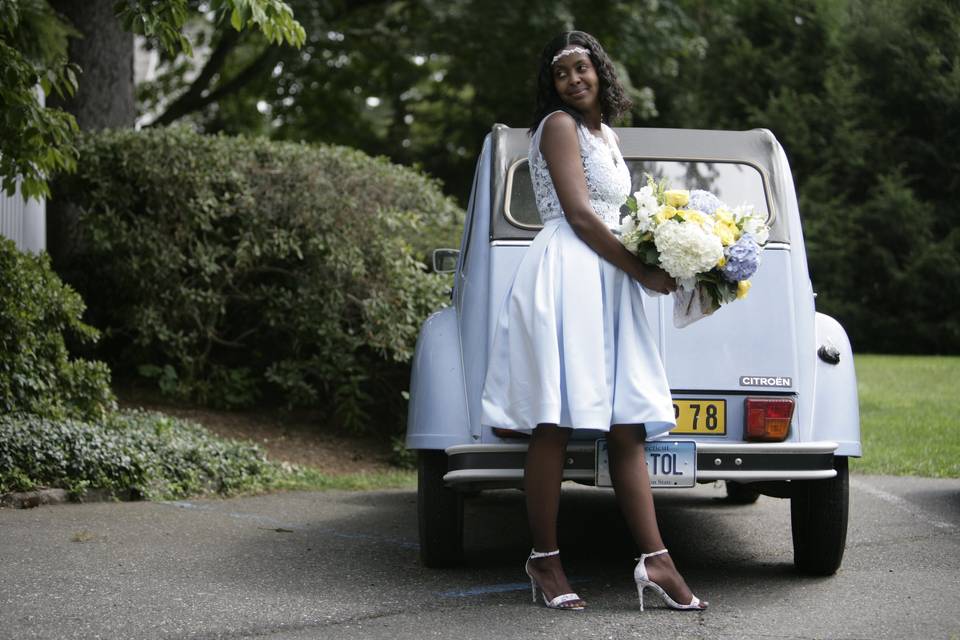 Bride with vintage car