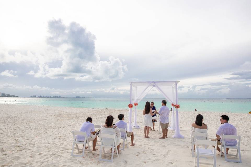 Vow renewal in beachscape Canc