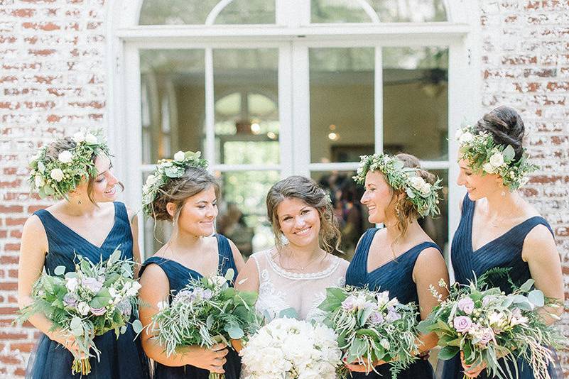 Happy bridal party on the side terrace