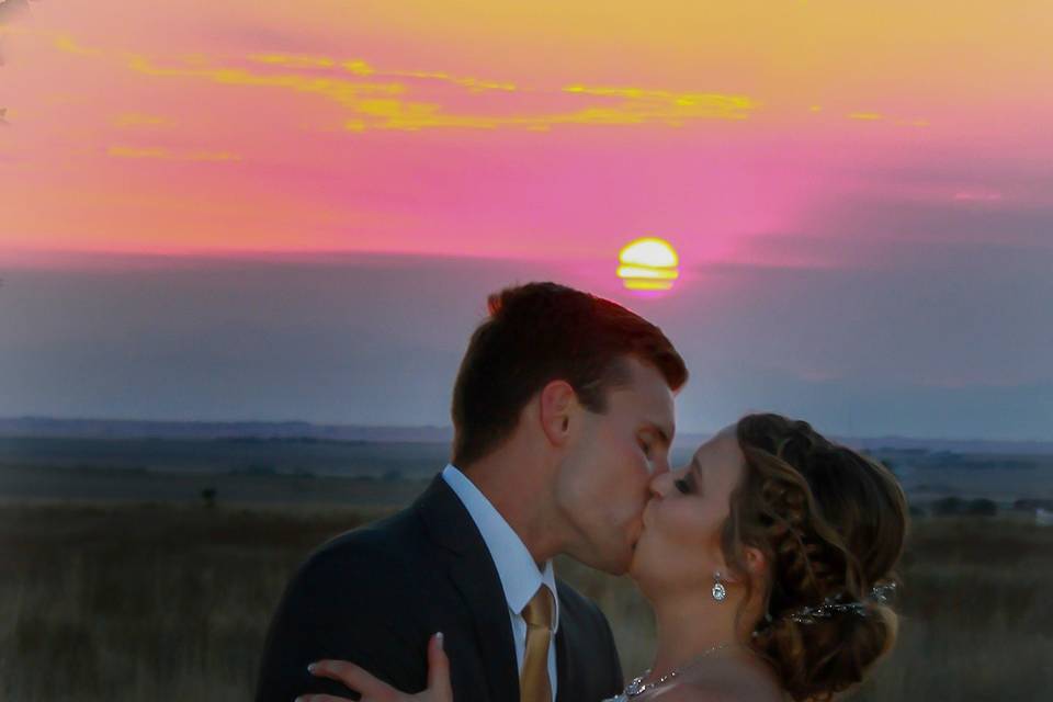 Kiss in front of the setting sun