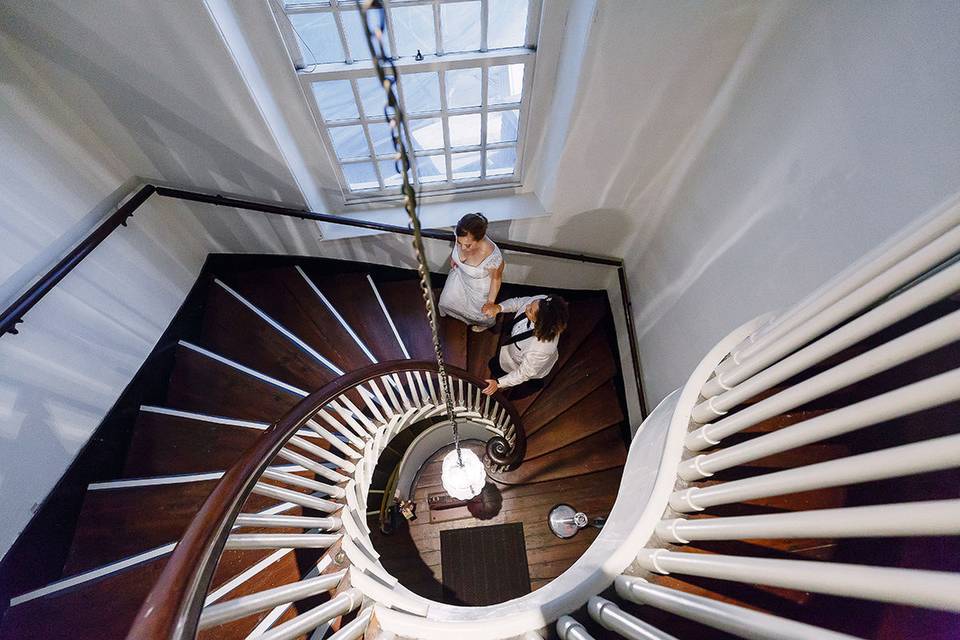 Brides ascend our historic staircase. Photography by alex paul.