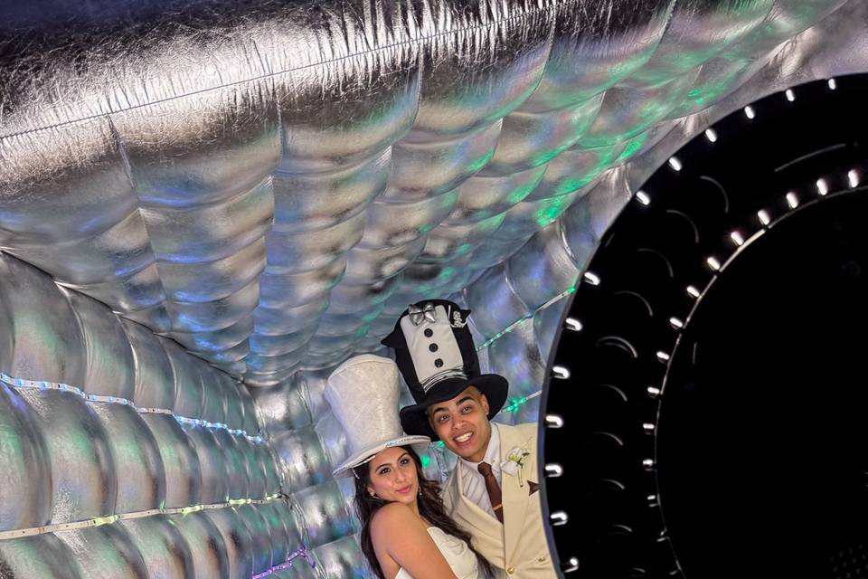 Bride and Groom in the Inflatable Photo Booth