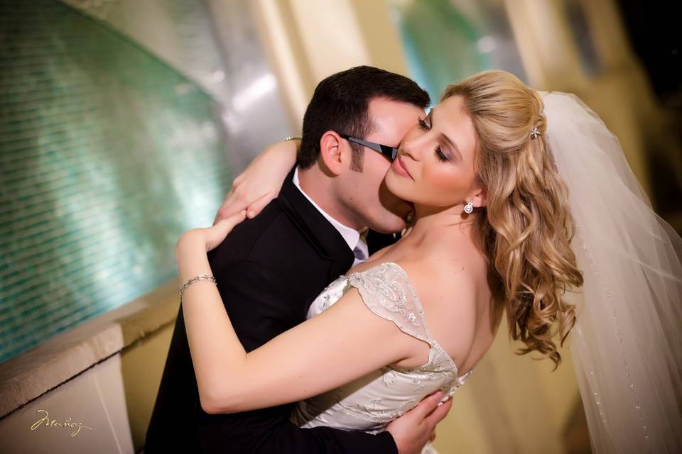 Groom kissing his bride