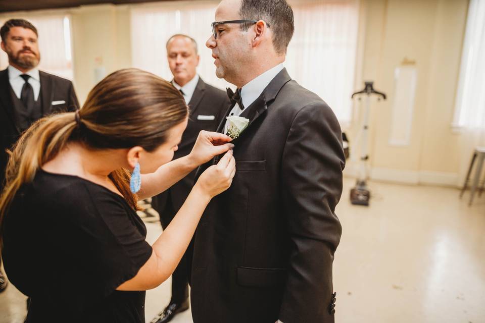 Pinning the groom