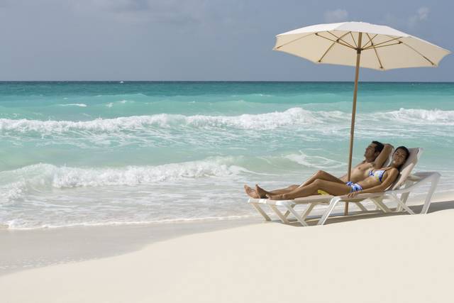 Couple relaxing on the beach