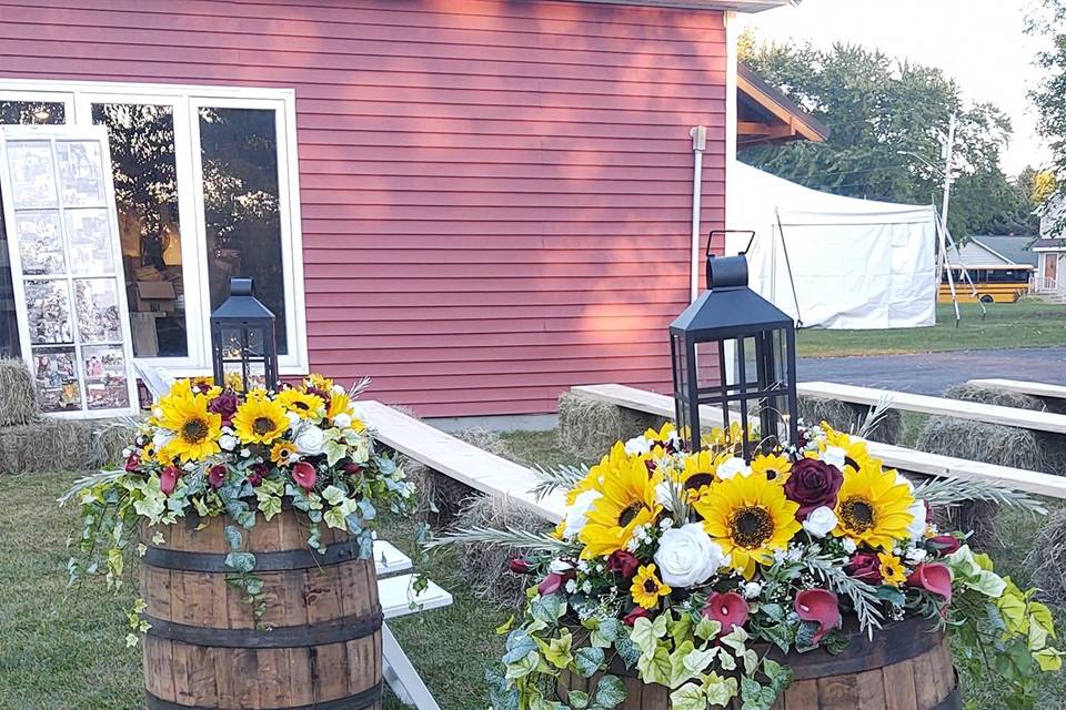 Whiskey barrels and flowers