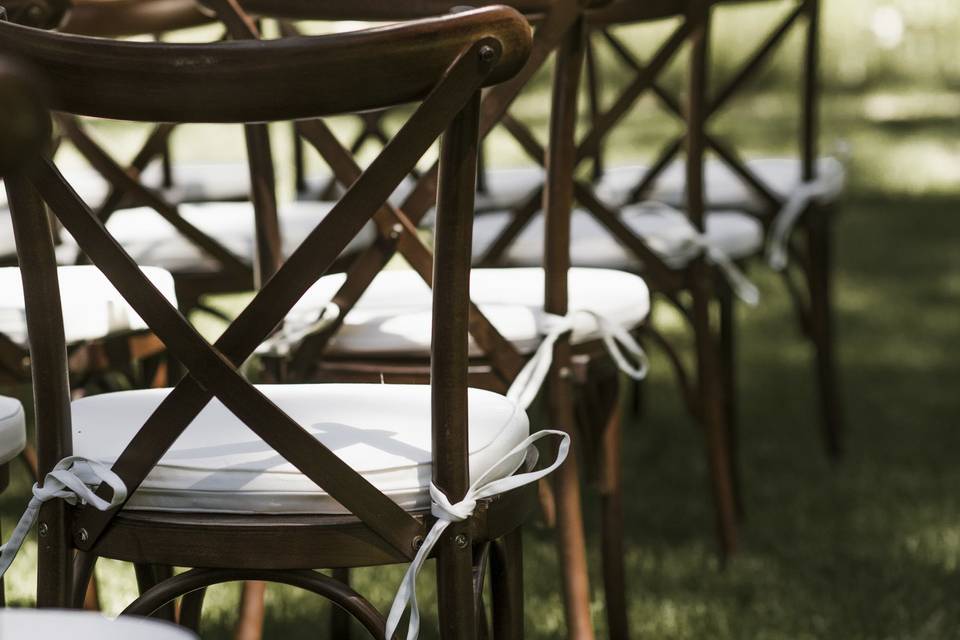 Wooden chairs set for ceremony