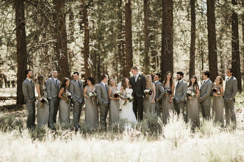 Newlyweds with the wedding attendants