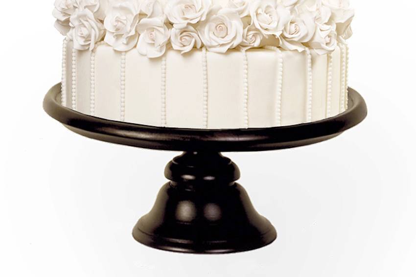 Whimsical fantasy wedding cake with spun sugar and edible flowers