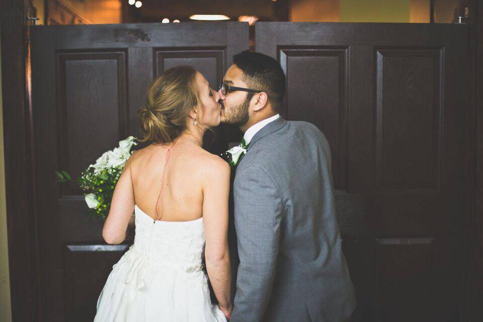 Newlyweds kissing