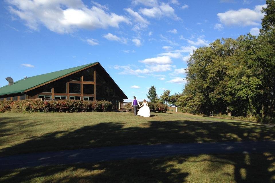 The bride and groom head back to the Quail Ridge Lodge from the gazebo to kick-off the reception after sharing their wedding vows.