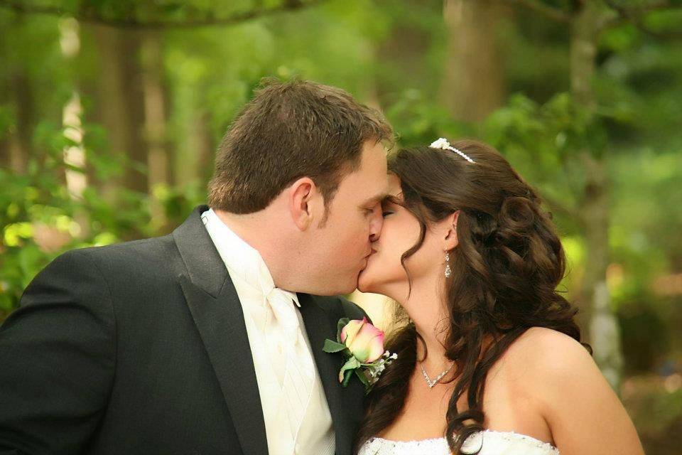 Groom and bride kissing