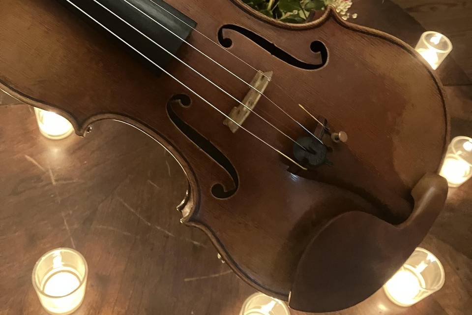 Violin with candles