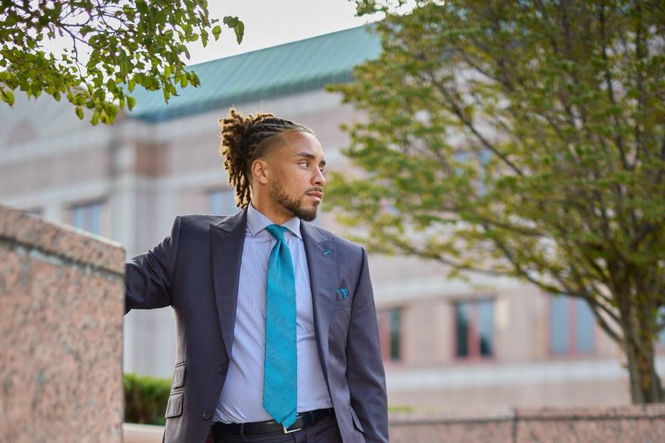 Suit with colorful tie