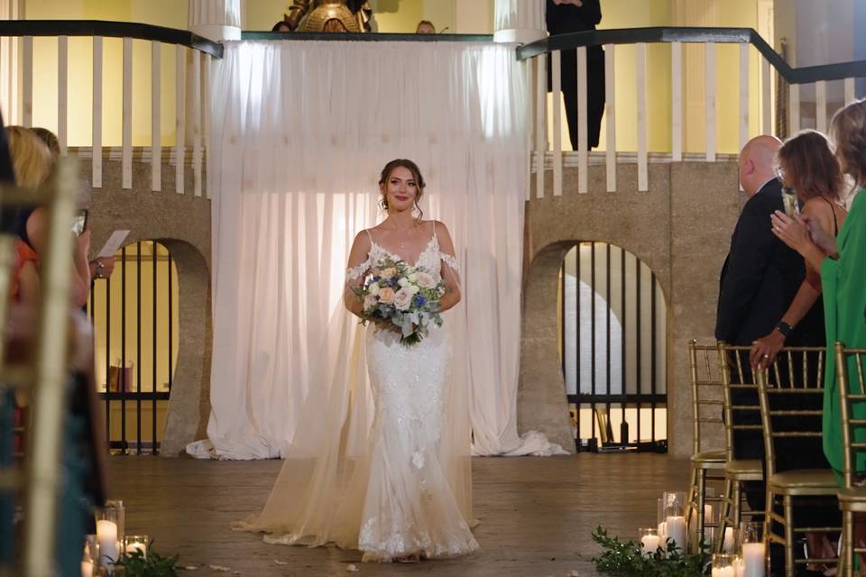 A radiant bride in a flowing w