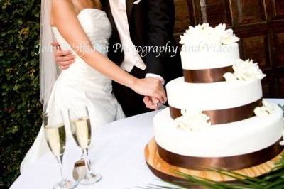 Couple cutting their wedding cake