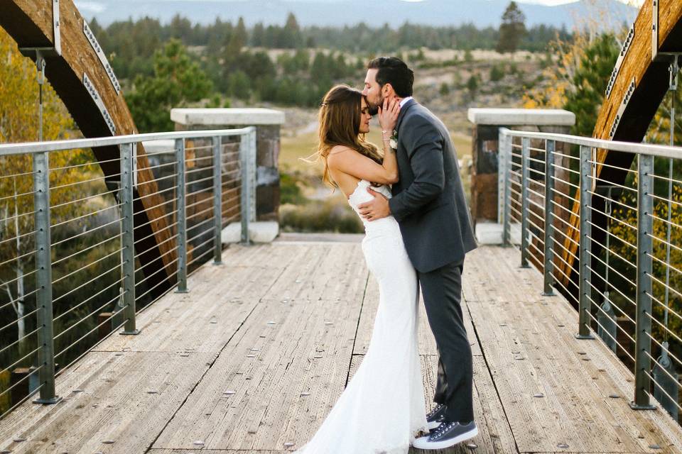 Newlyweds kiss on the bridge