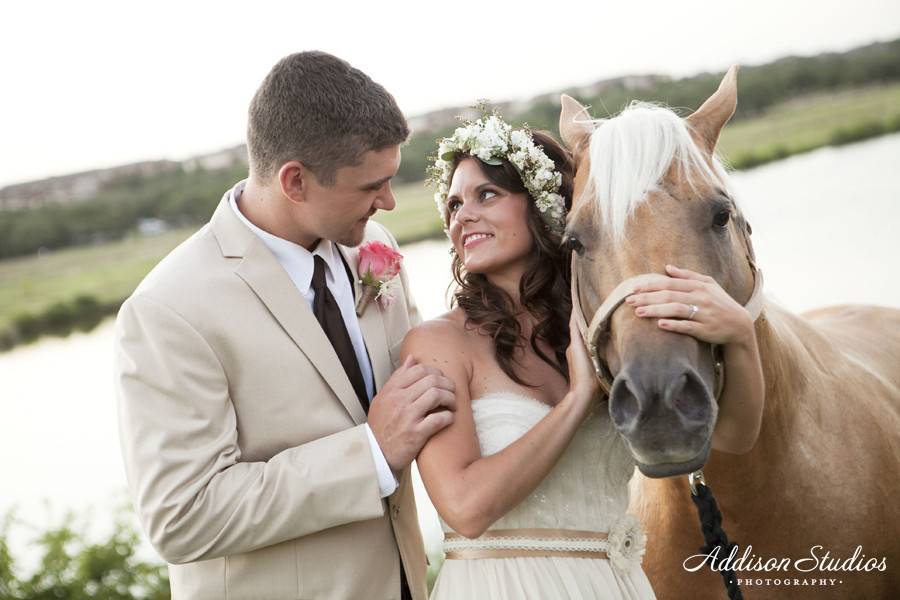 Bride hugging the horse