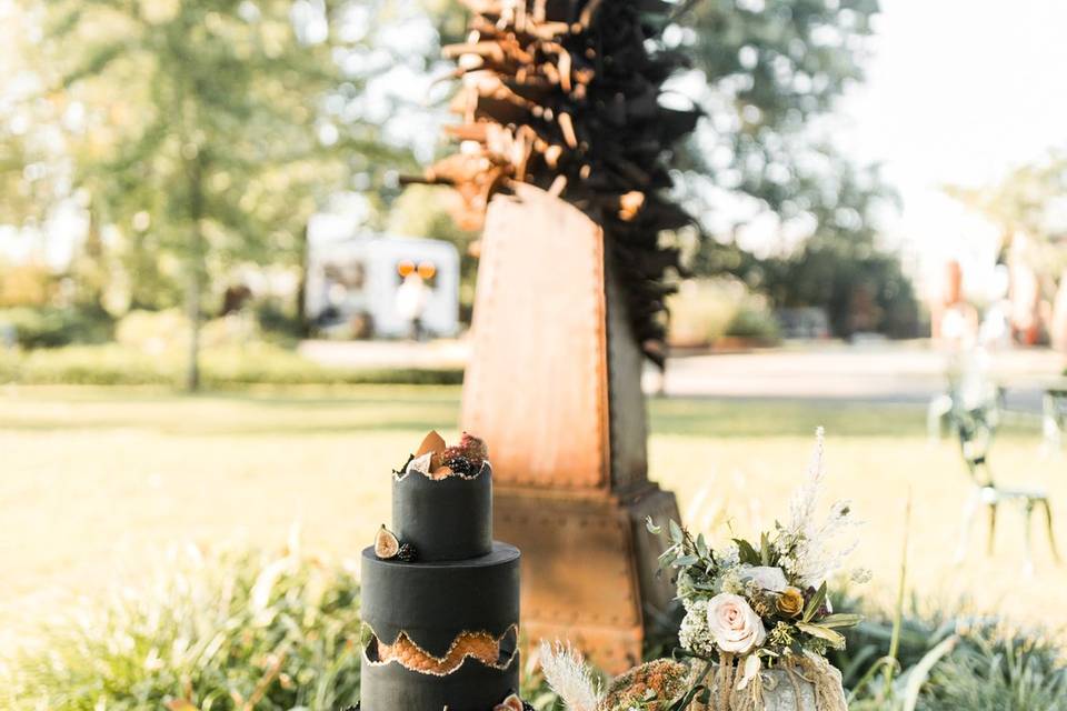 Cake in front of sculpture