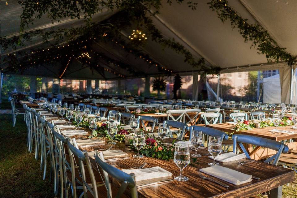 a bookcase draped with a garland of greenery is such a unique wedding ceremony backdrop wedding reception venues memphis wedding photographers memphis weddings on airbnb wedding venues memphis tn