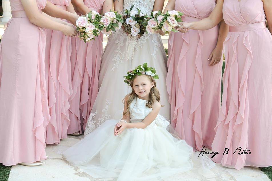 A lovely bridal party and adorable flower girl