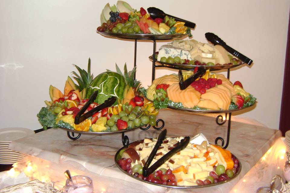 A display of Cheese, Fruit and Vegetables.