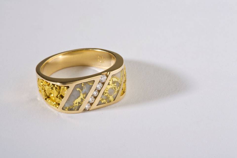 Gold Tilted Heart Ring with Diamond:  $725.00
This unique tilted heart ring is 14kt Yellow Gold and supports A.05ct. GS11 Diamond.