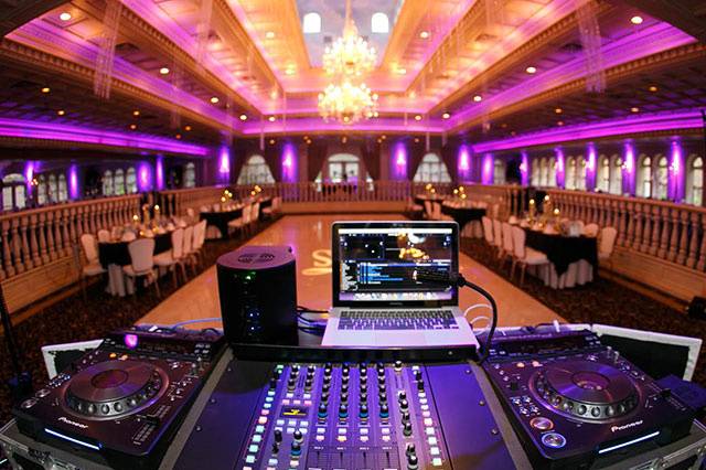 DJ De-mand's DJ booth setup at a wedding