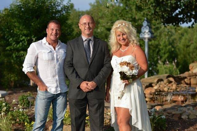 Newlyweds with the officiant