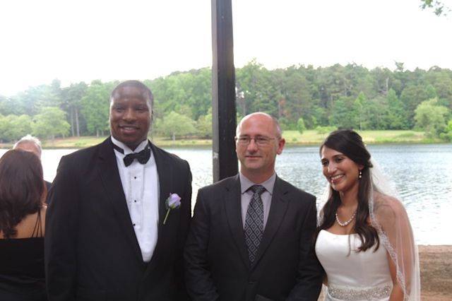 Newlyweds with the officiant