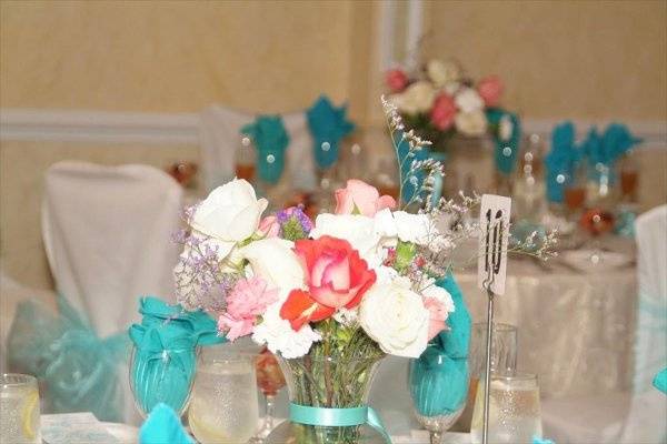 Center Pieces made with real fresh roses and carnations by MMalave Events