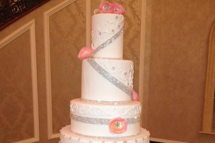 White wedding cake with a touch of pink